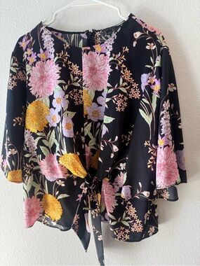 Ann Taylor floral tie front blouse with bell sleeves. Size XL.